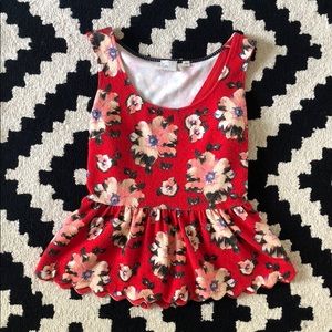 Floral peplum tank with scallop detail and cutout